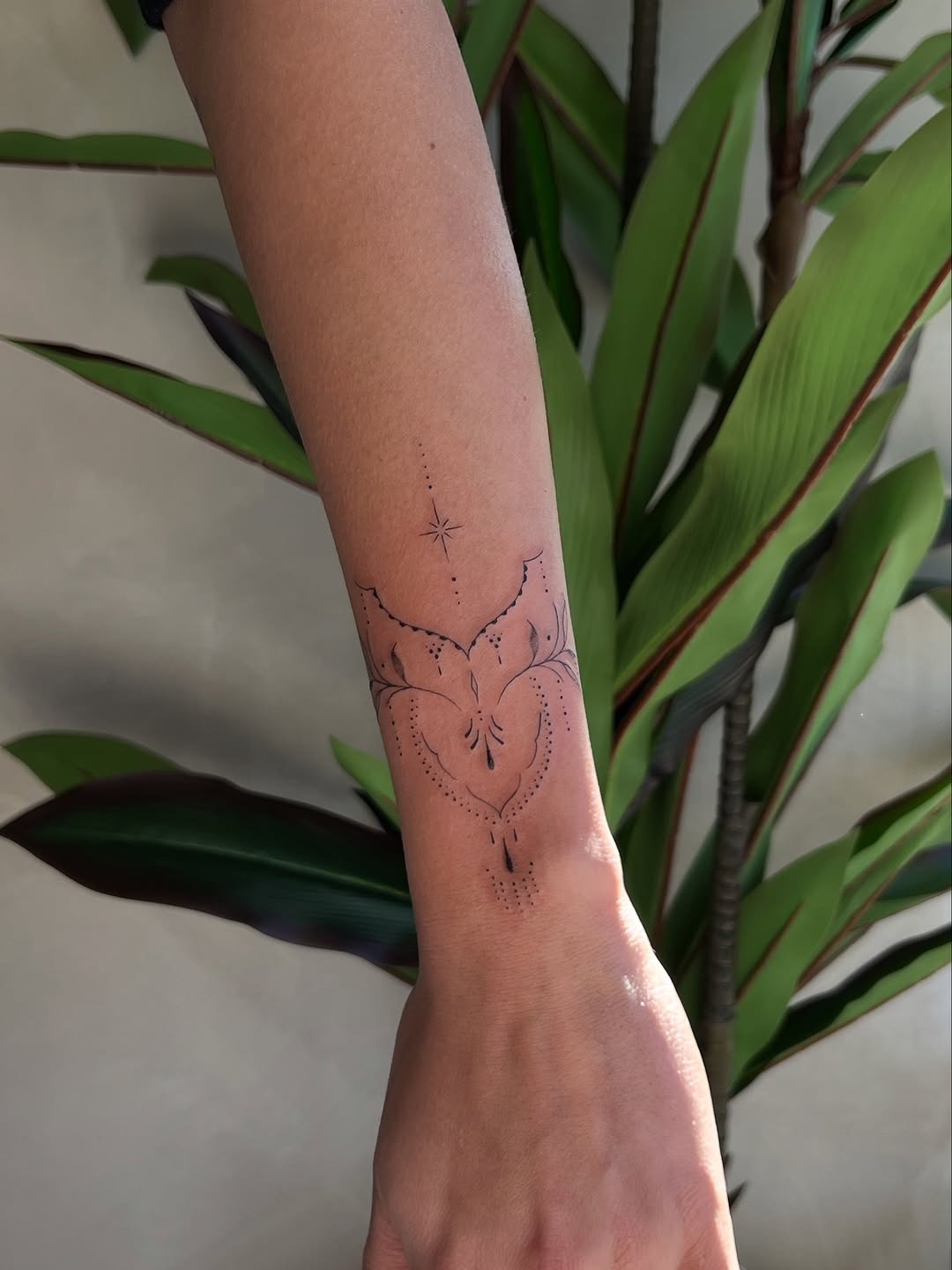 Delicate Ornamental Wrist Tattoo