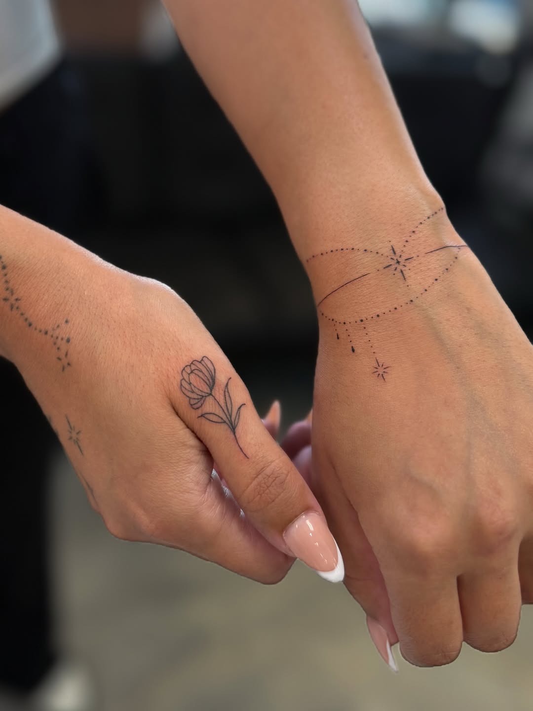 Minimalist Fine-Line Hand Tattoo