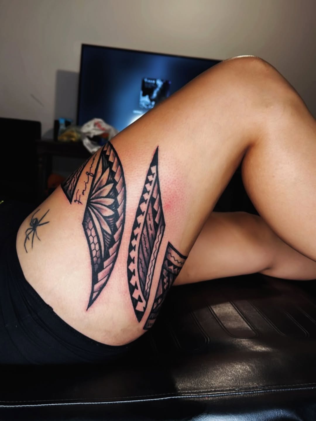 Bold tribal thigh band tattoo
