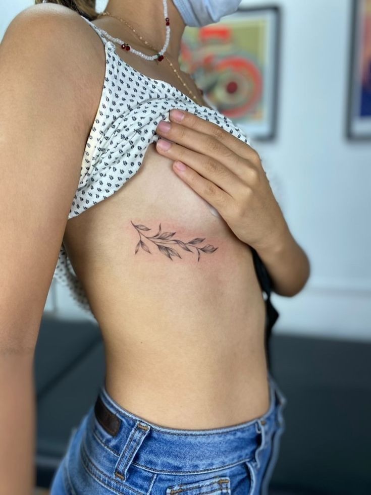 Elegant Botanical Side-Bust Tattoo