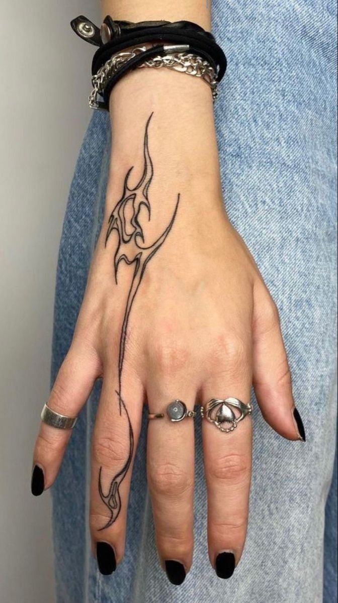 Edgy tribal hand tattoo design