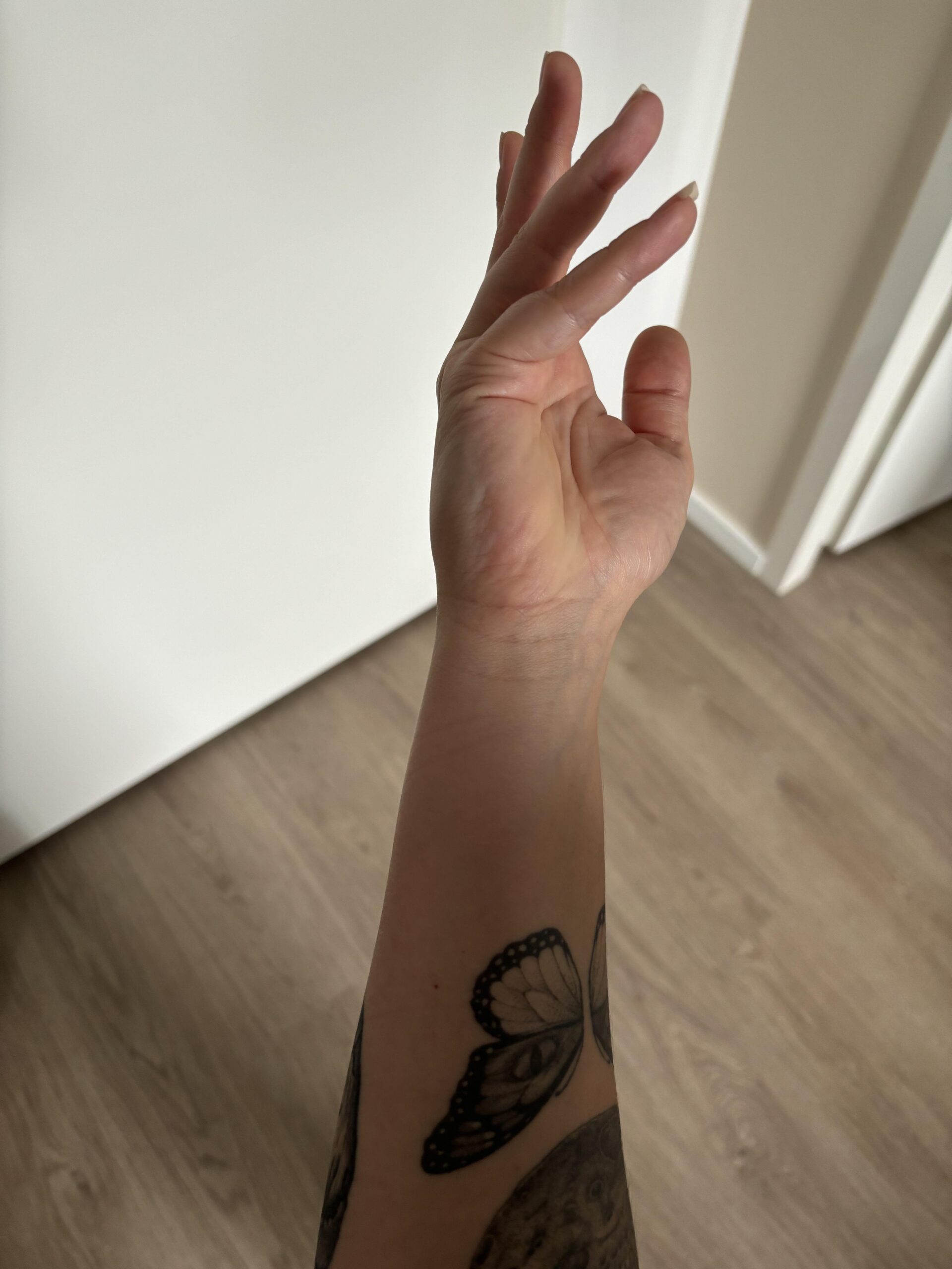 Charming butterfly wrist tattoo