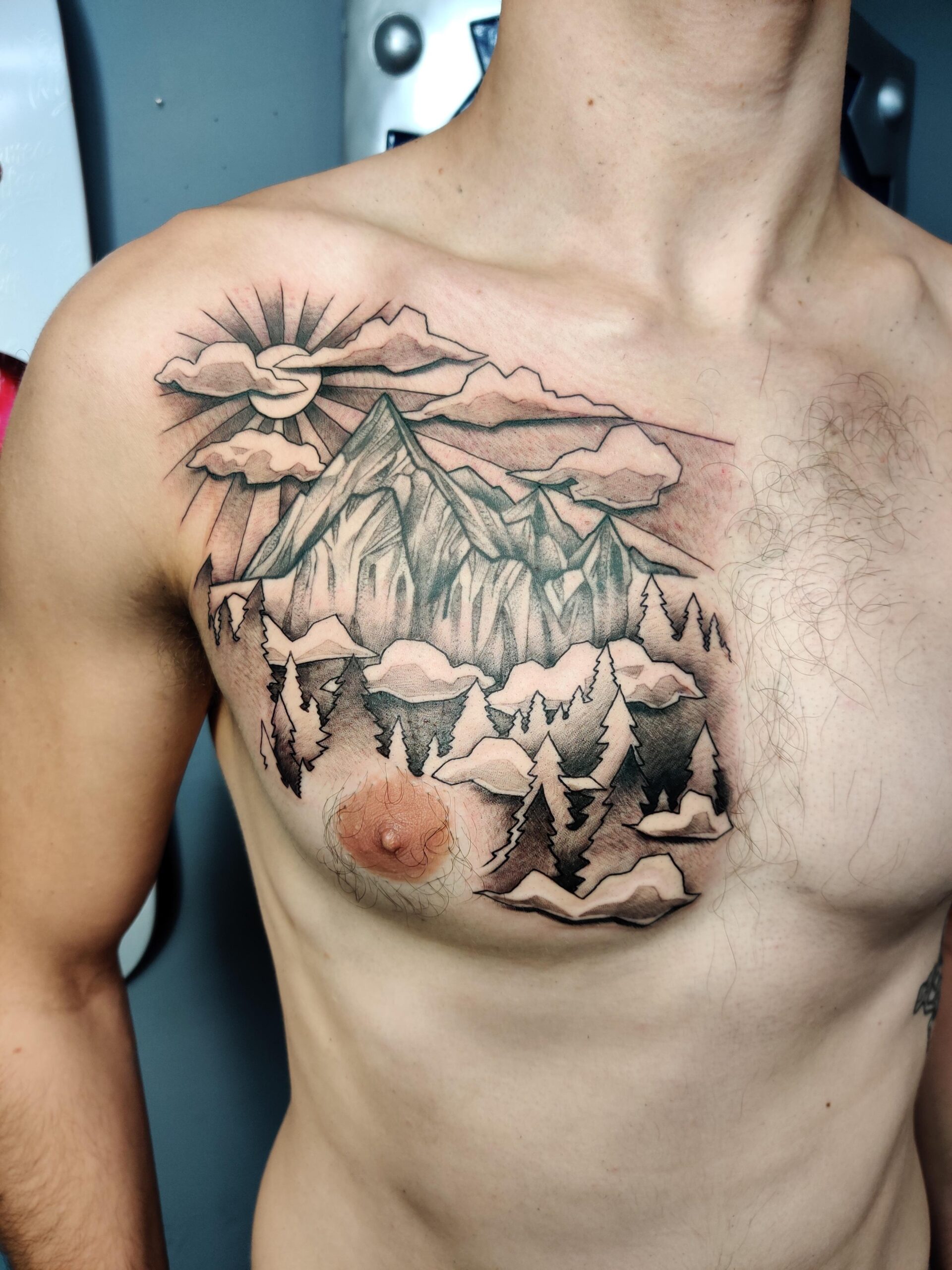 Mountain landscape chest tattoo