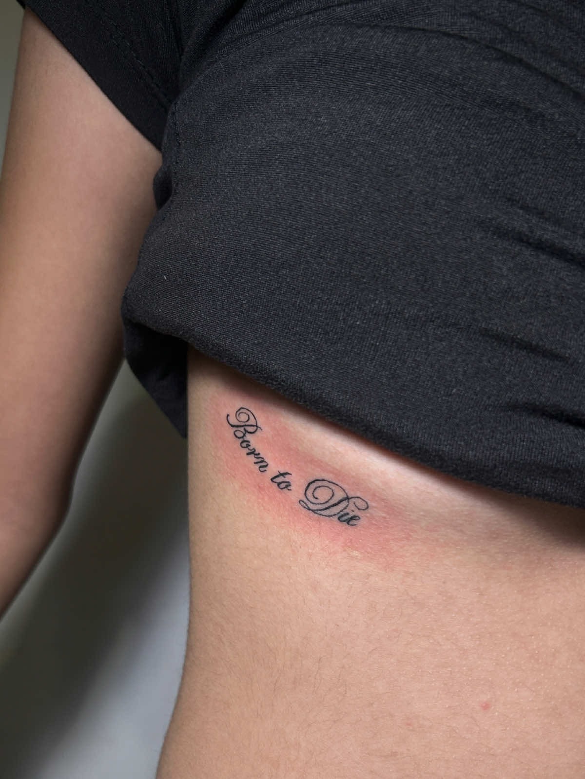 Minimalist Script Under-Breast Tattoo