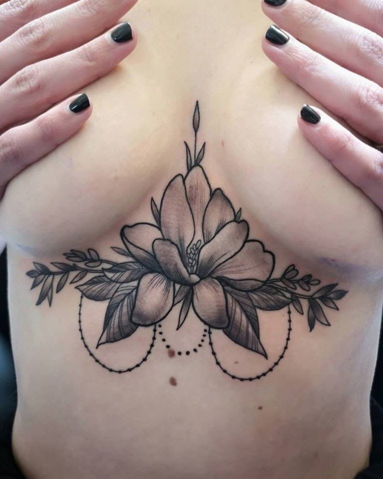 Intricate floral sternum tattoo art