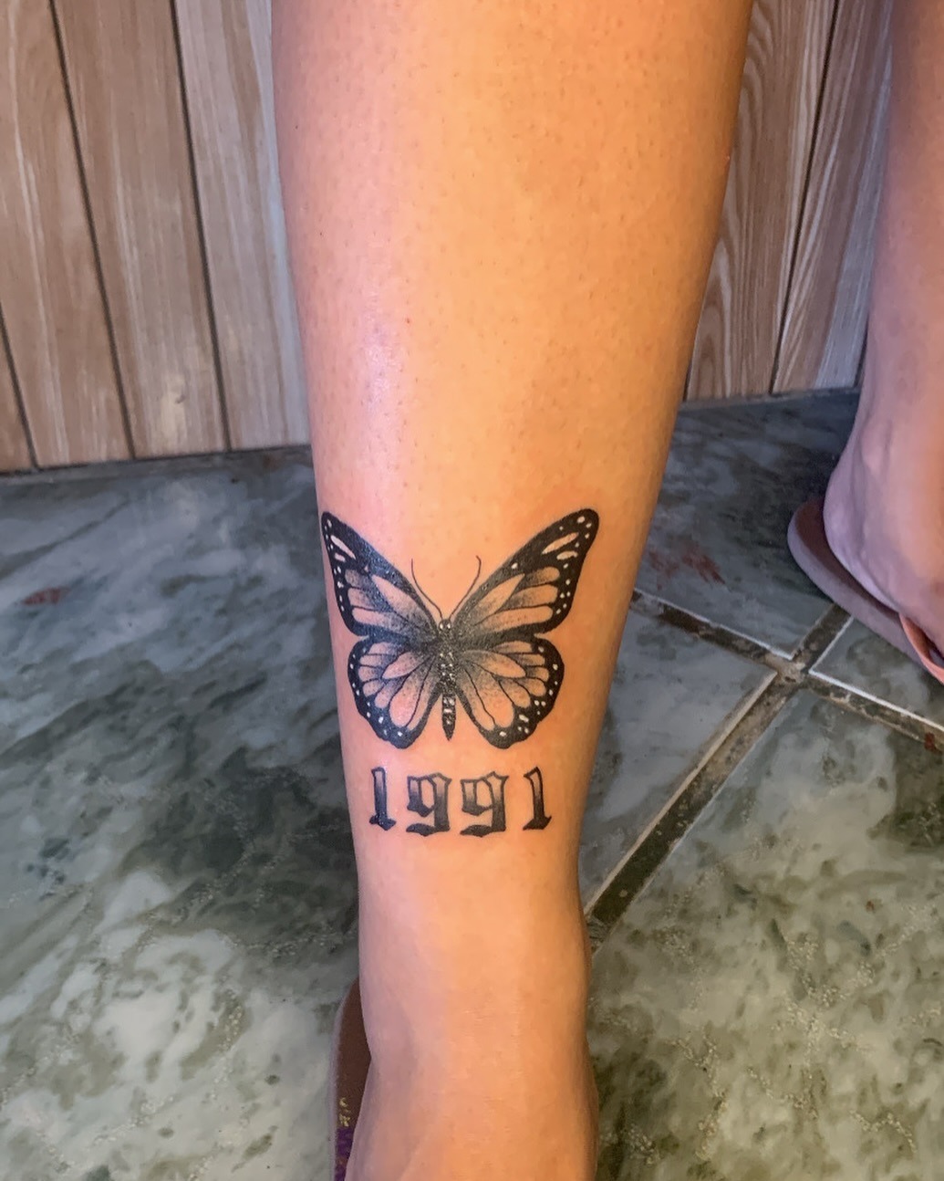 Delicate Butterfly Shin Tattoo with Date