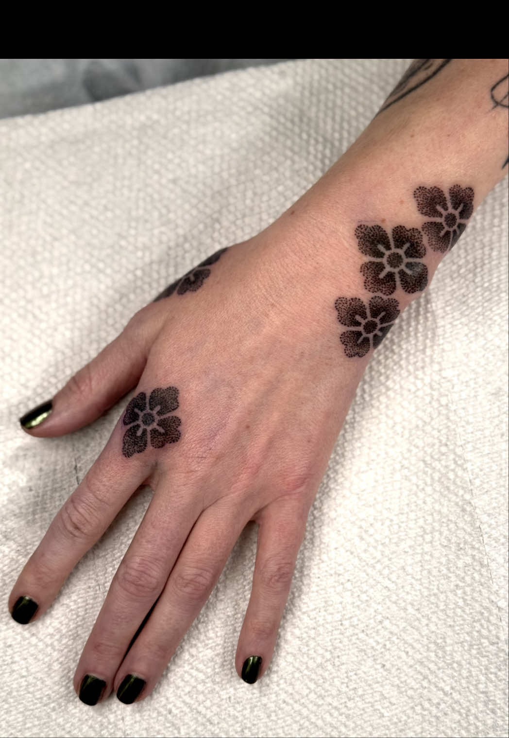 Delicate Floral Hand Tattoo