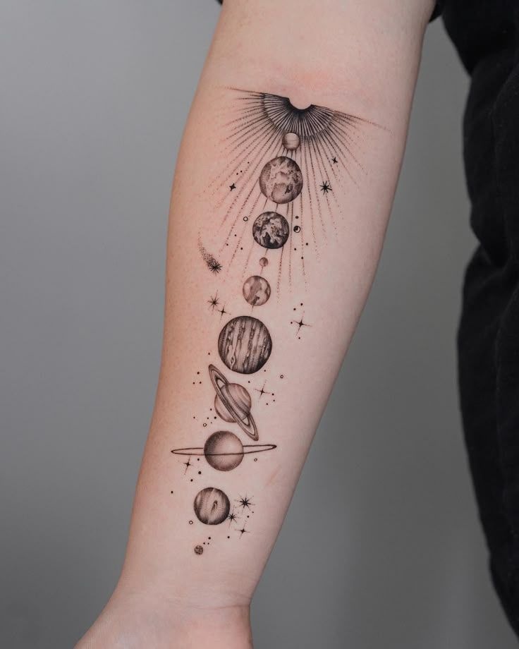 Intricate solar system arm tattoo