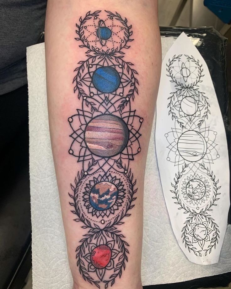 Vibrant mandala-style planet tattoo