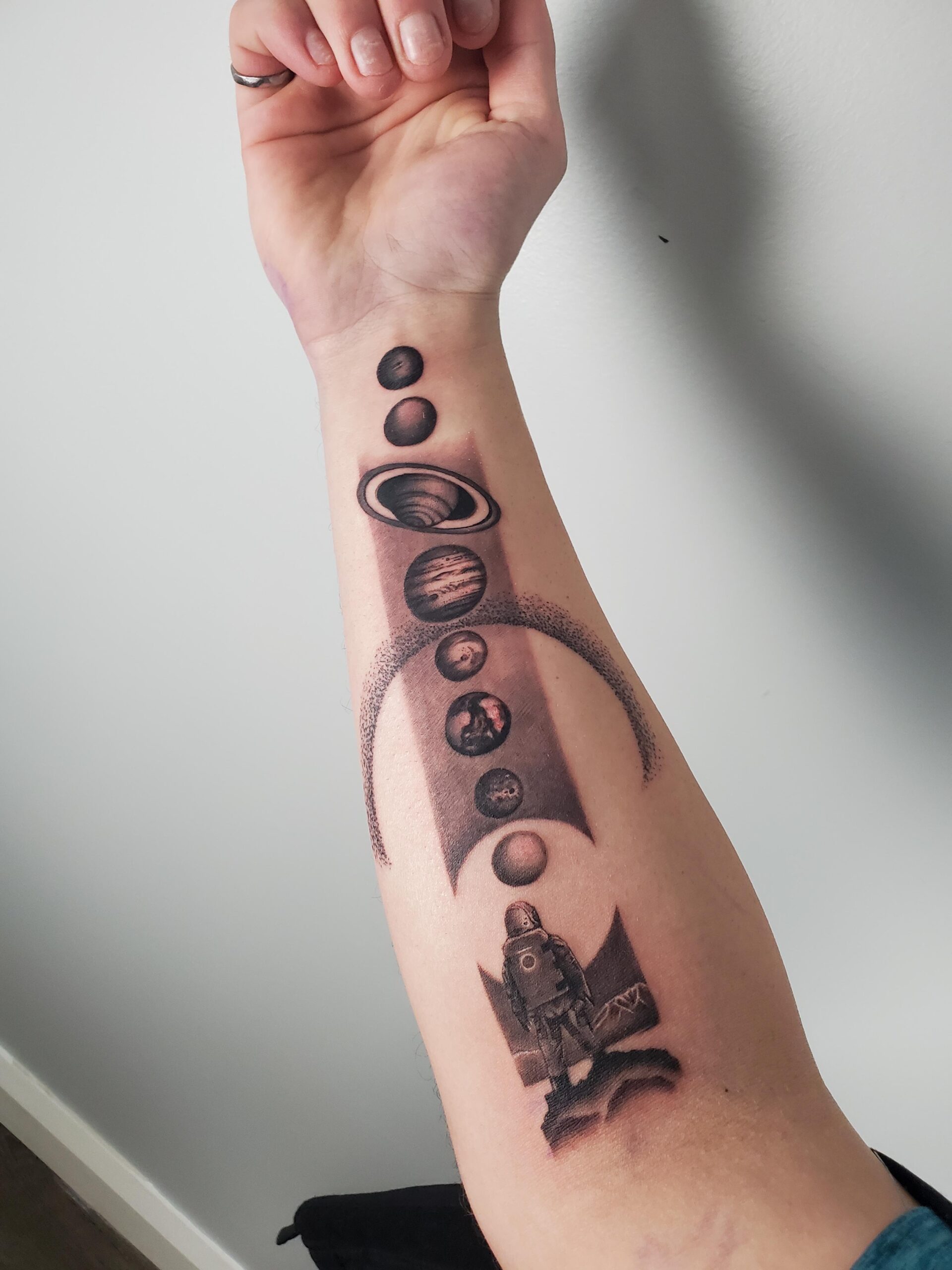 Detailed Astronaut and Planet Tattoo