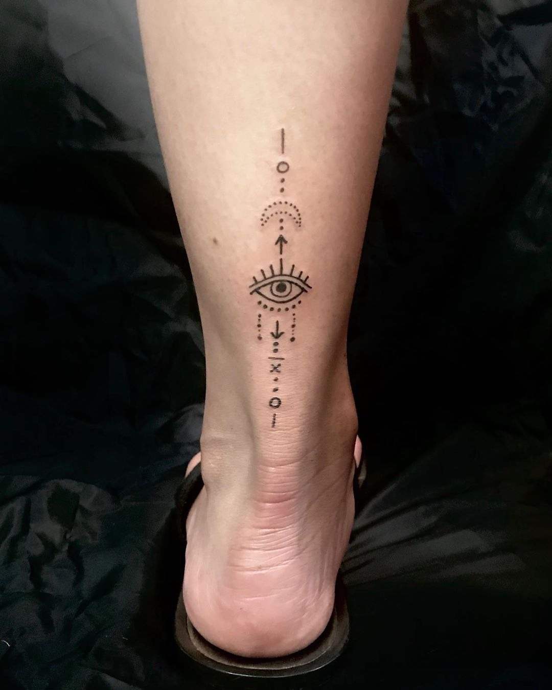 Minimalist Third Eye Ankle Tattoo