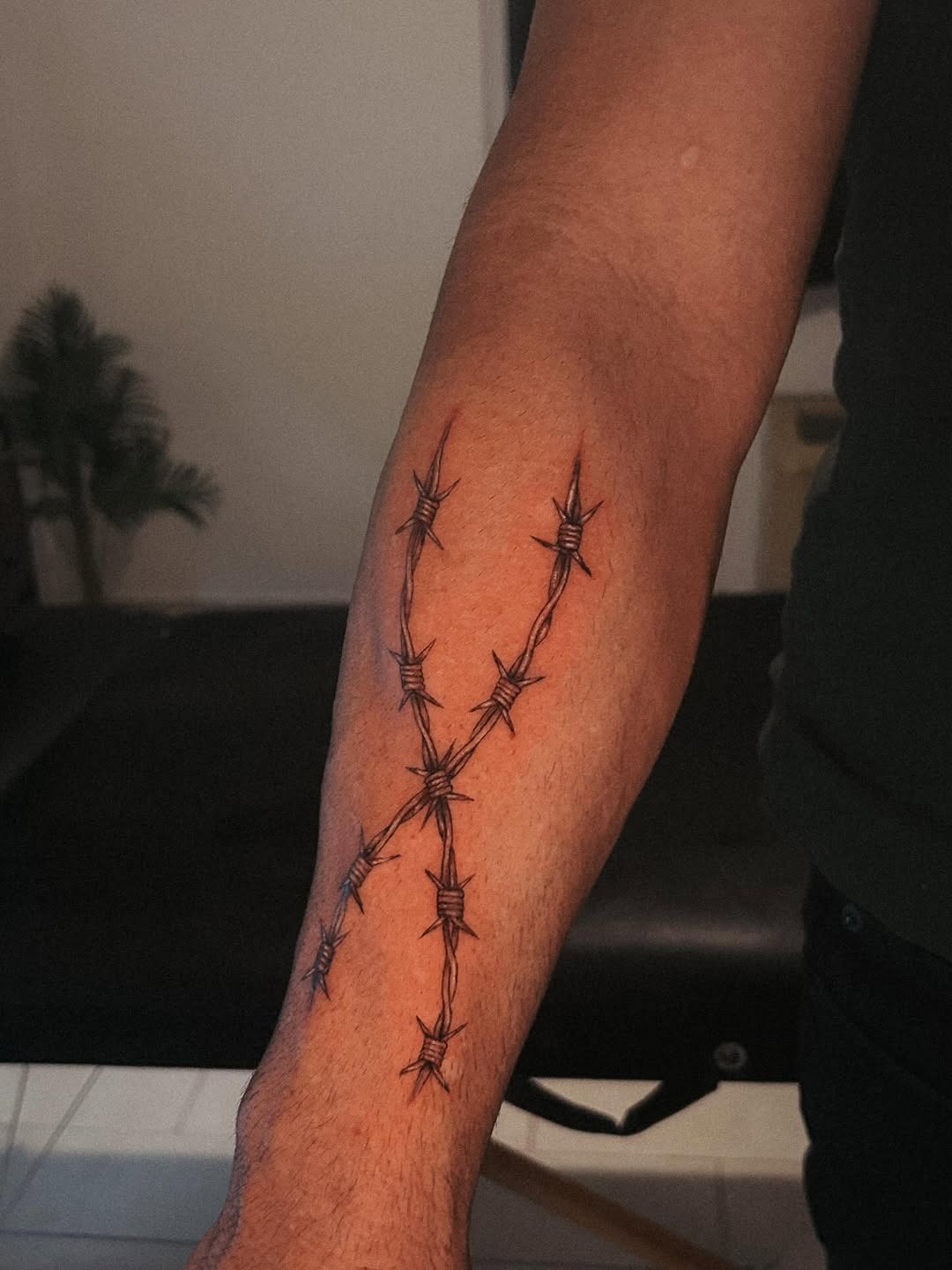 Stylized Cross Barbed Wire Tattoo