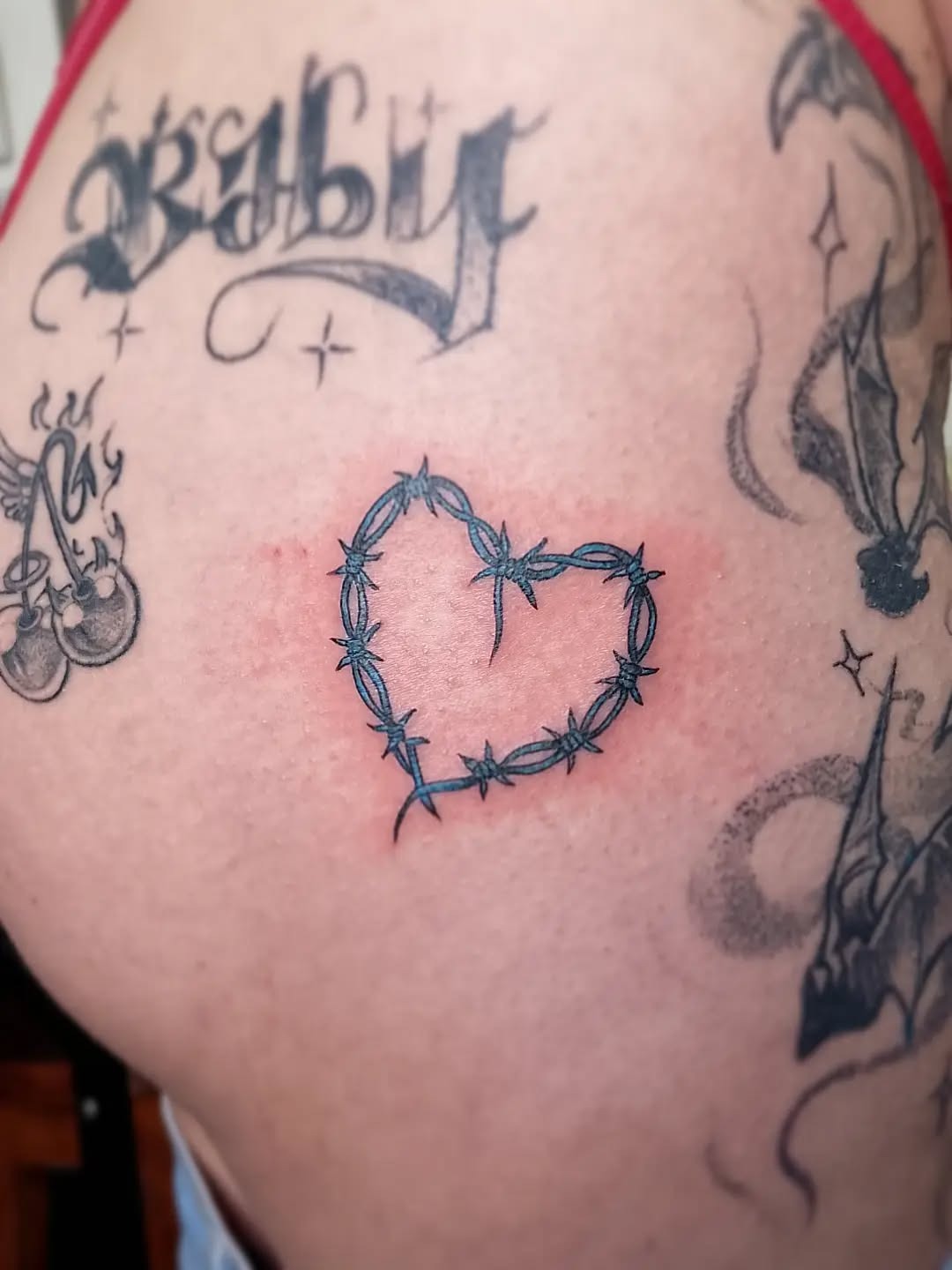 Minimalist Barbed Wire Heart Tattoo