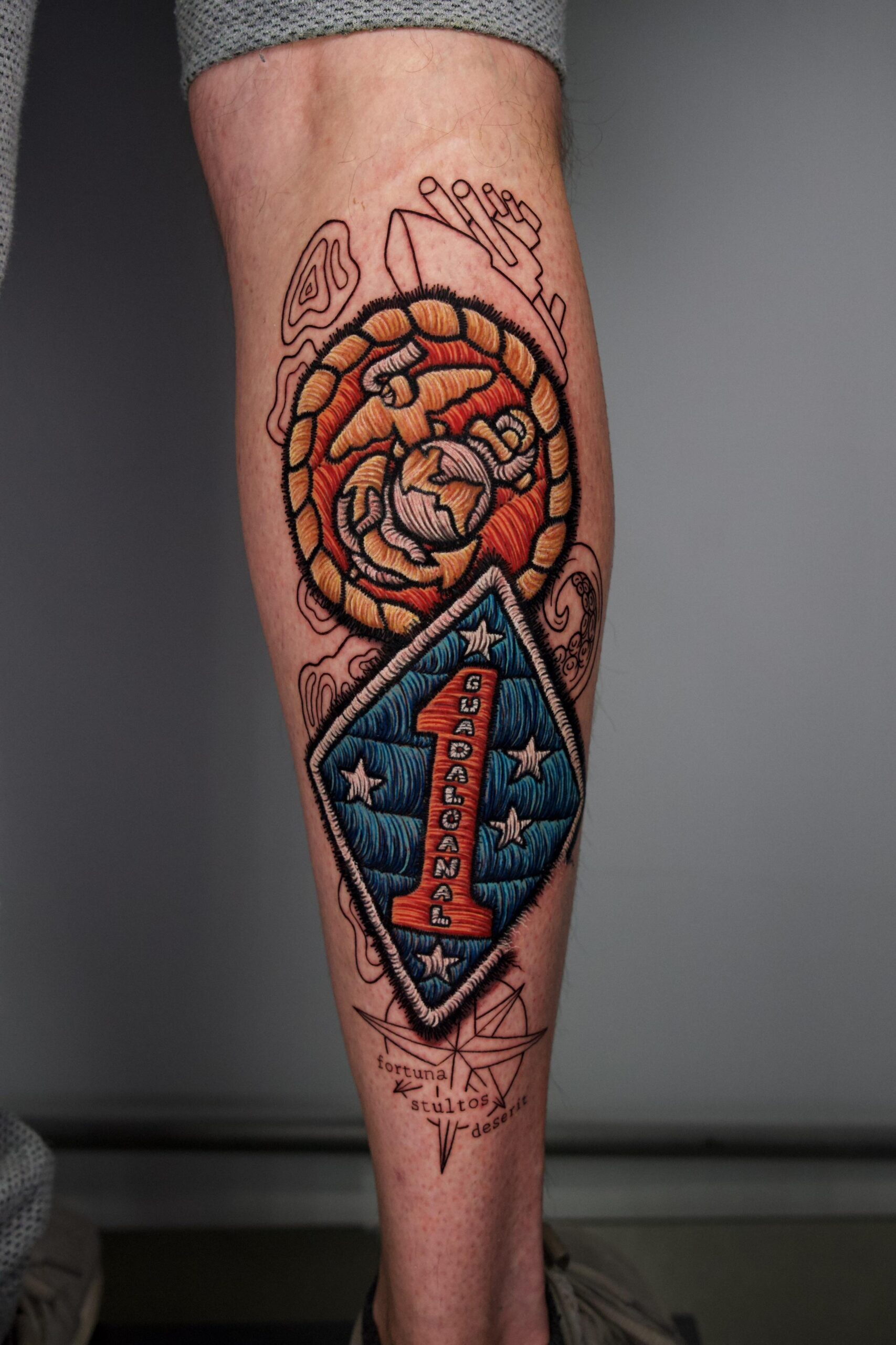 Bold Military-Inspired Lower Leg Tattoo