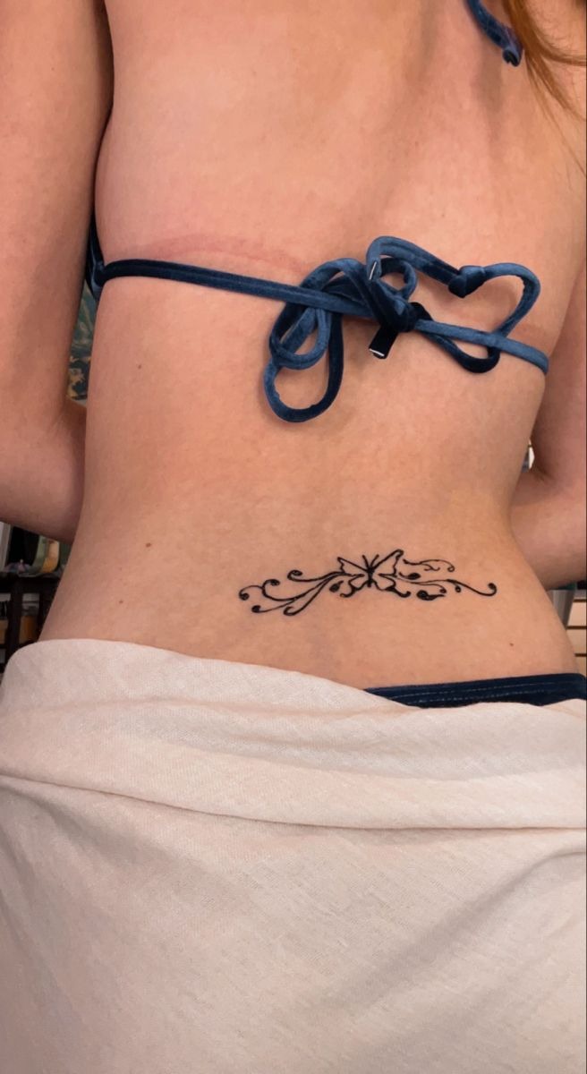 Delicate Butterfly Lower Back Tattoo Inspiration