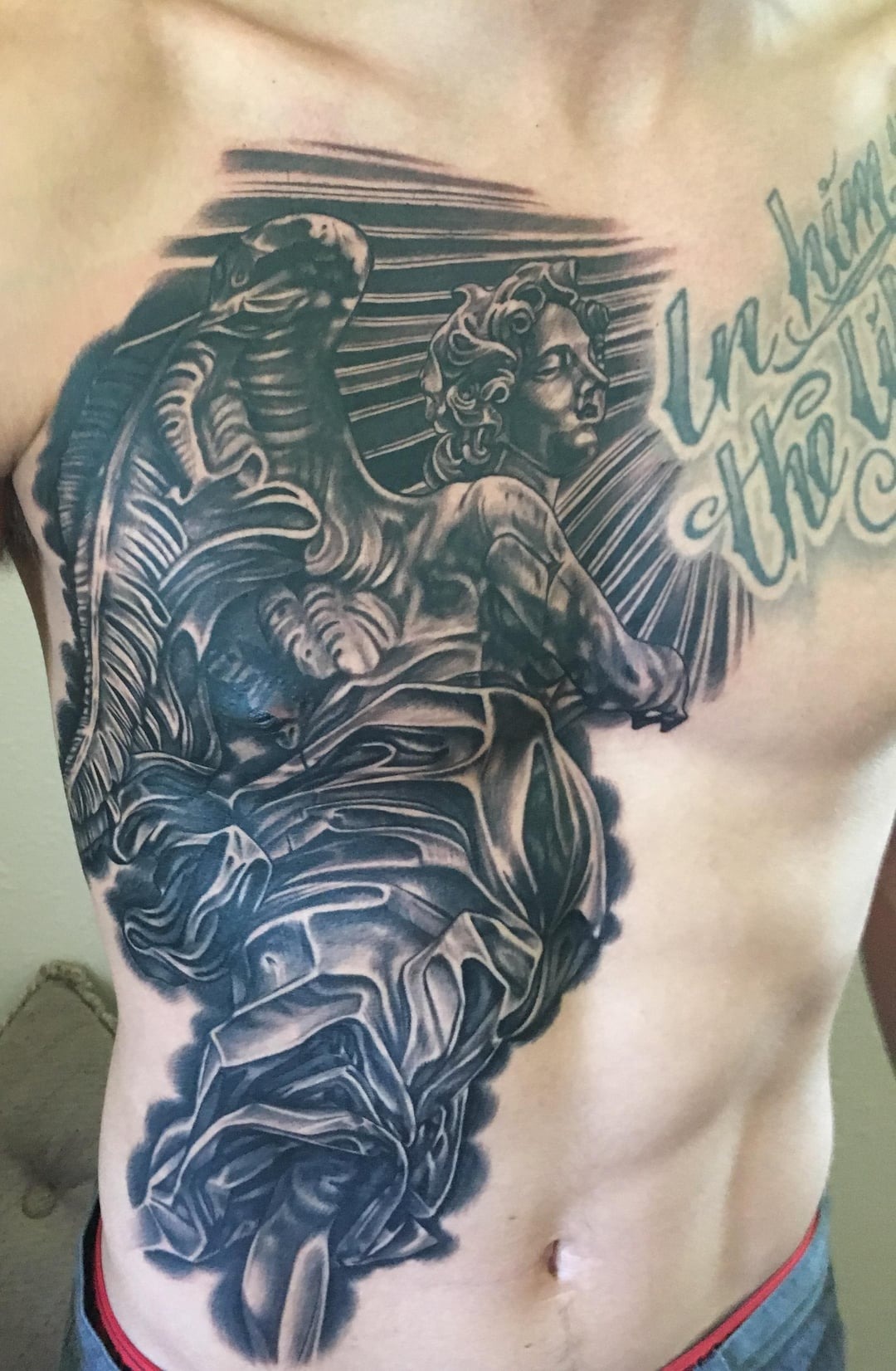 Divine Inspiration: Detailed Religious Chest Tattoo
