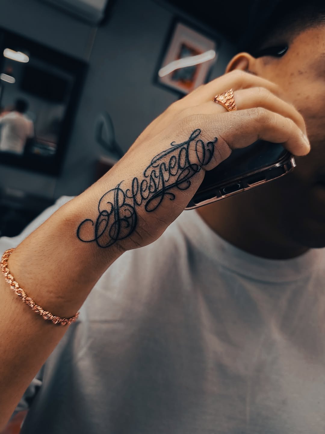 Elegant Cursive 'Blessed' Hand Tattoo