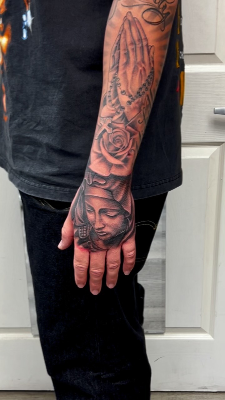 Detailed Religious Sleeve Tattoo