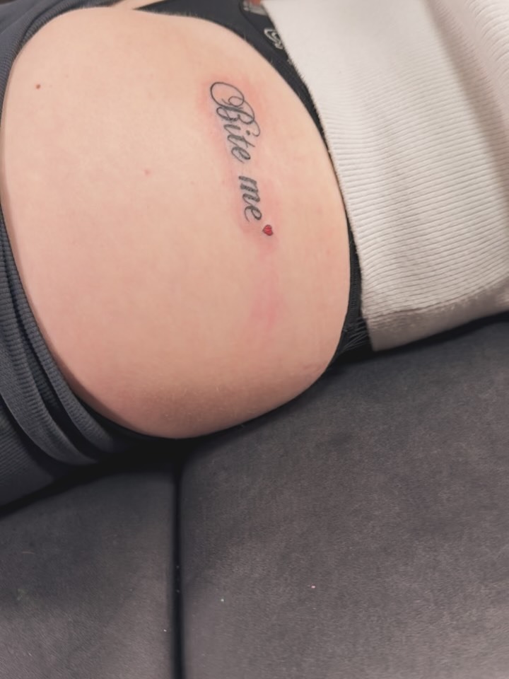 Dainty 'Bite Me' Script Tattoo
