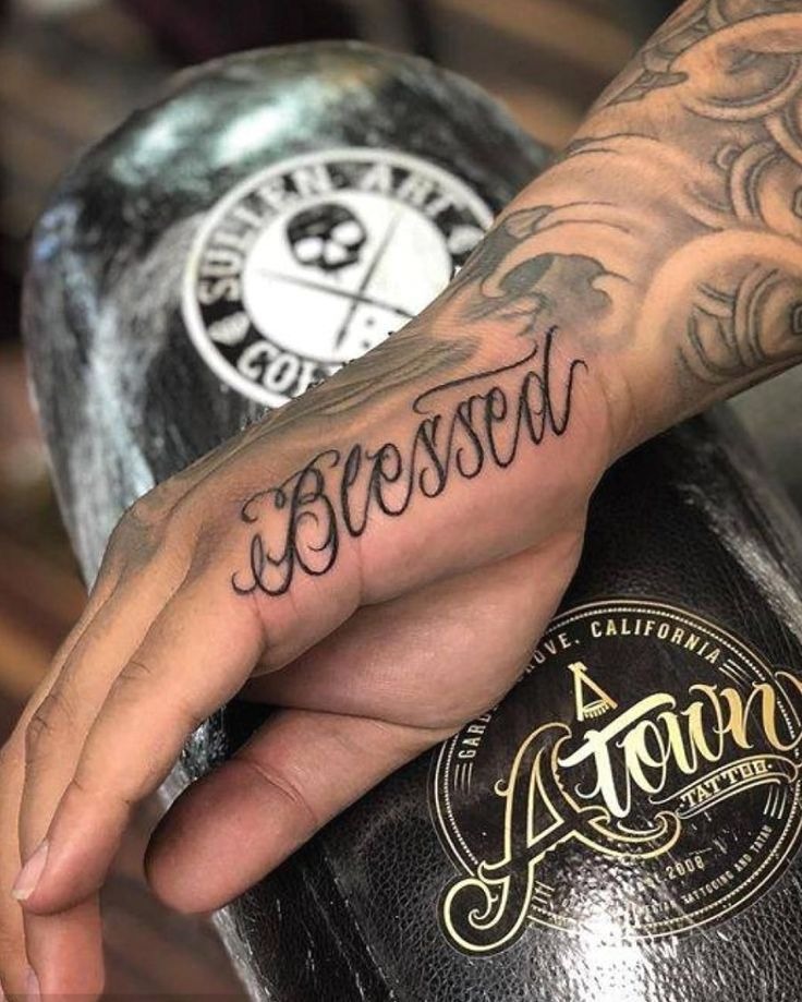 Classic hand-script 'Blessed' tattoo