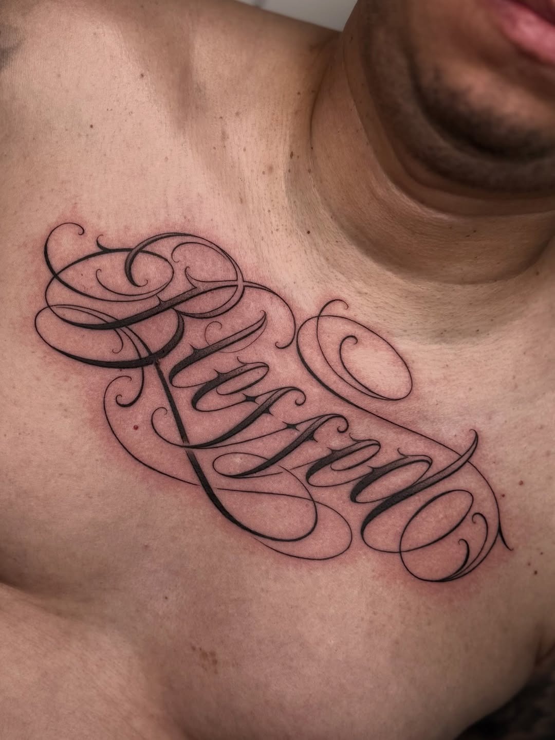 Detailed chest script tattoo design