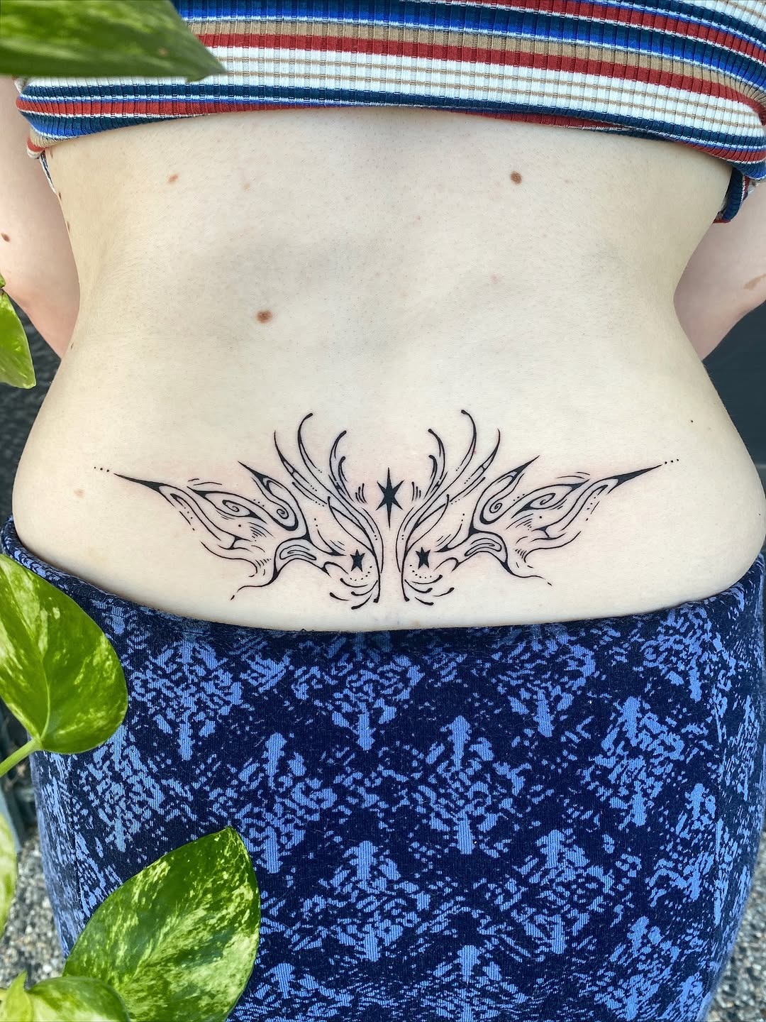 Delicate Ornamental Lower Back Tattoo
