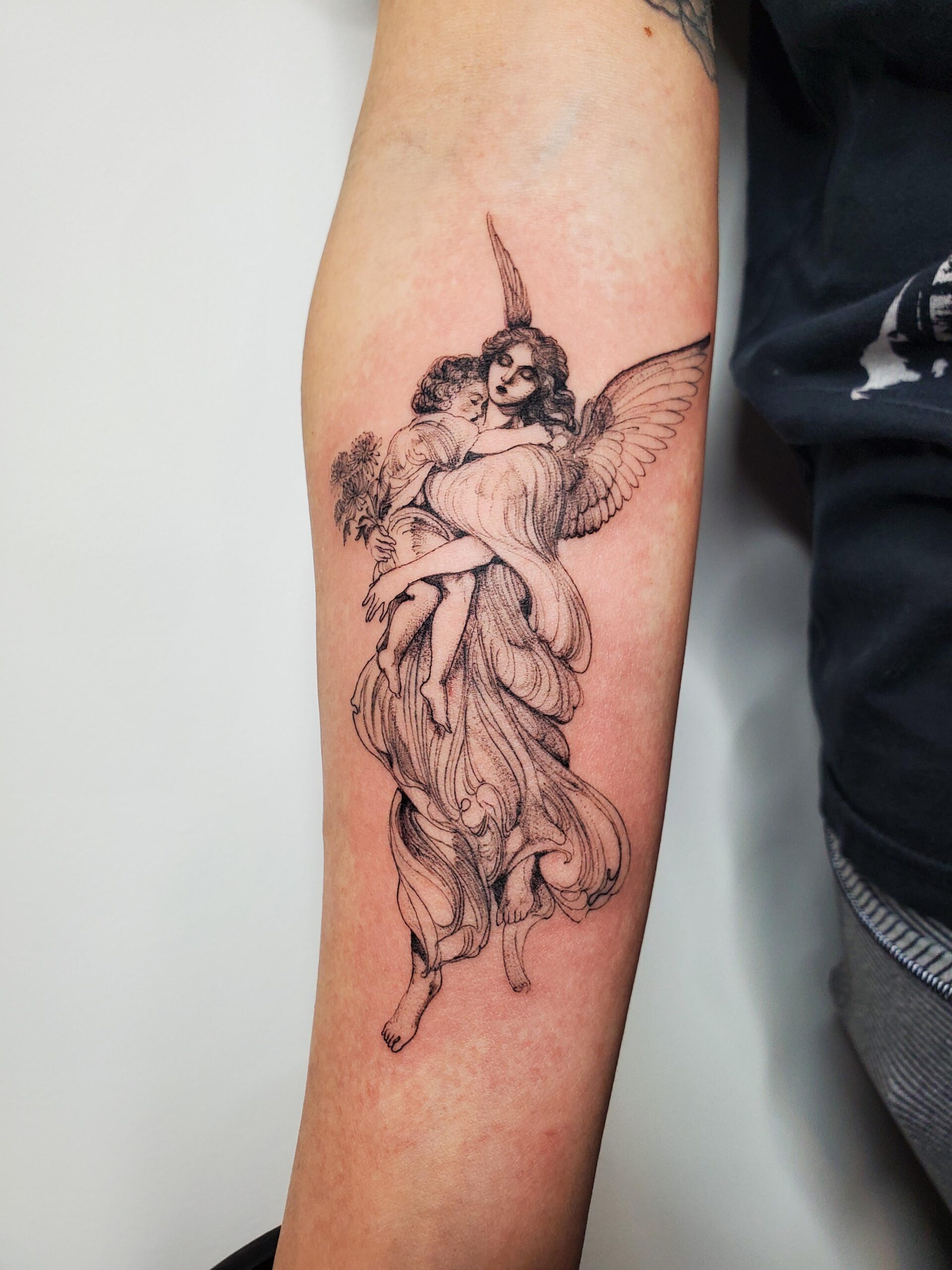 Evocative Angel Memorial Tattoo