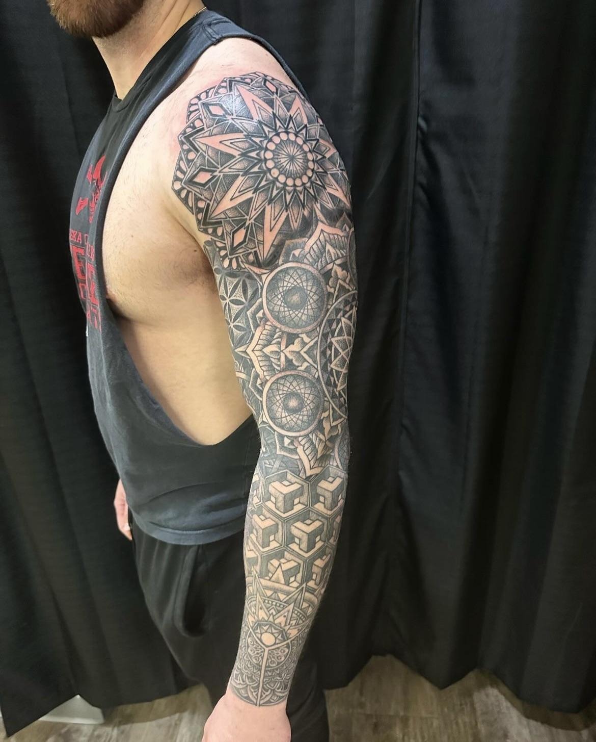 Bold geometric full-sleeve tattoo