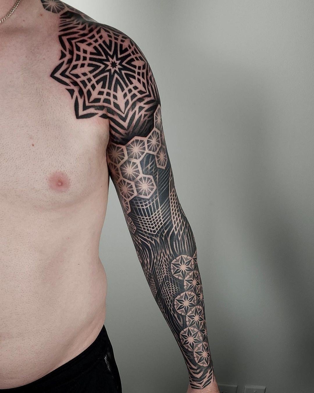 Sacred geometry pattern sleeve tattoo