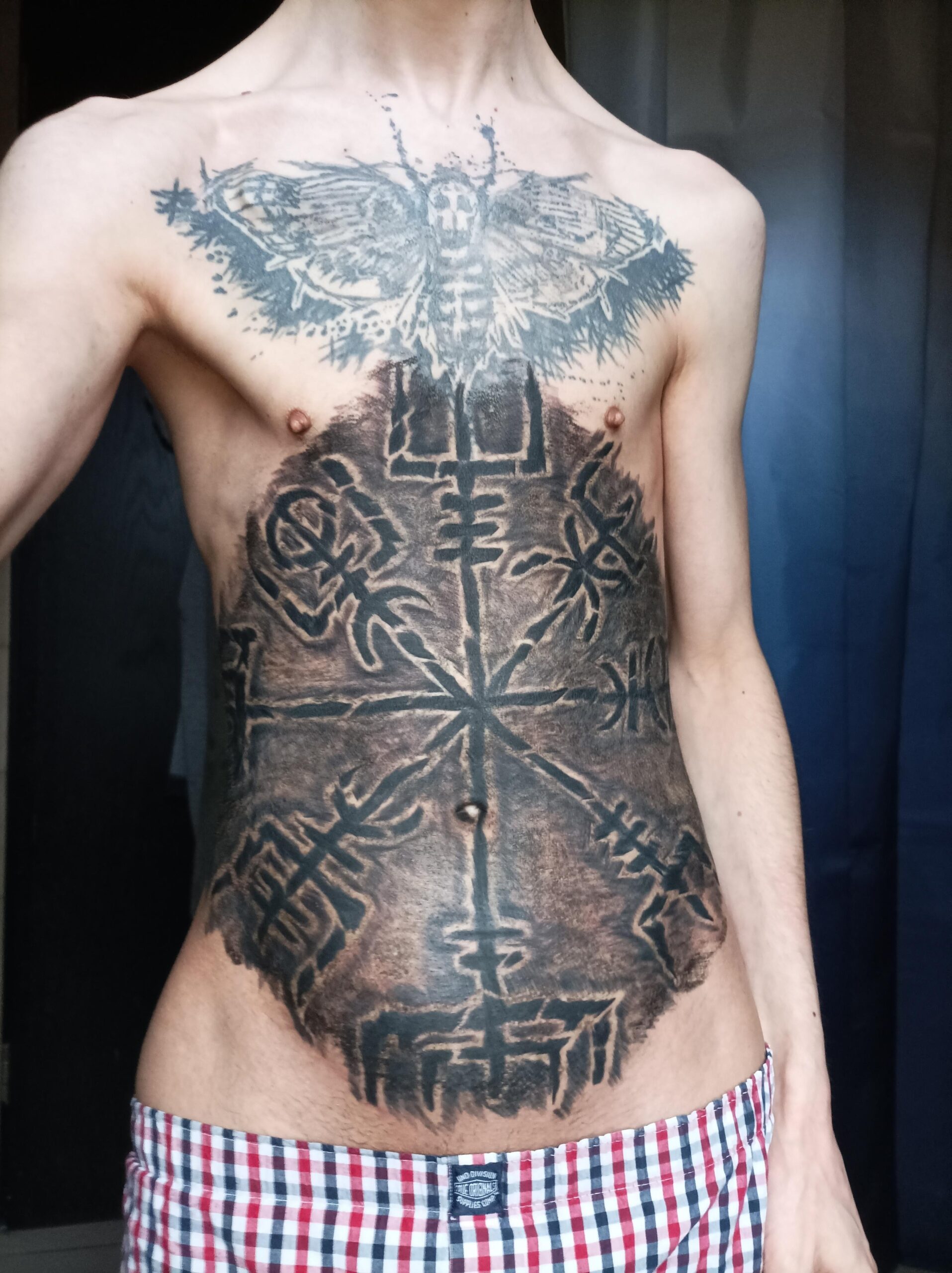 Detailed Geometric Center-Chest Tattoo