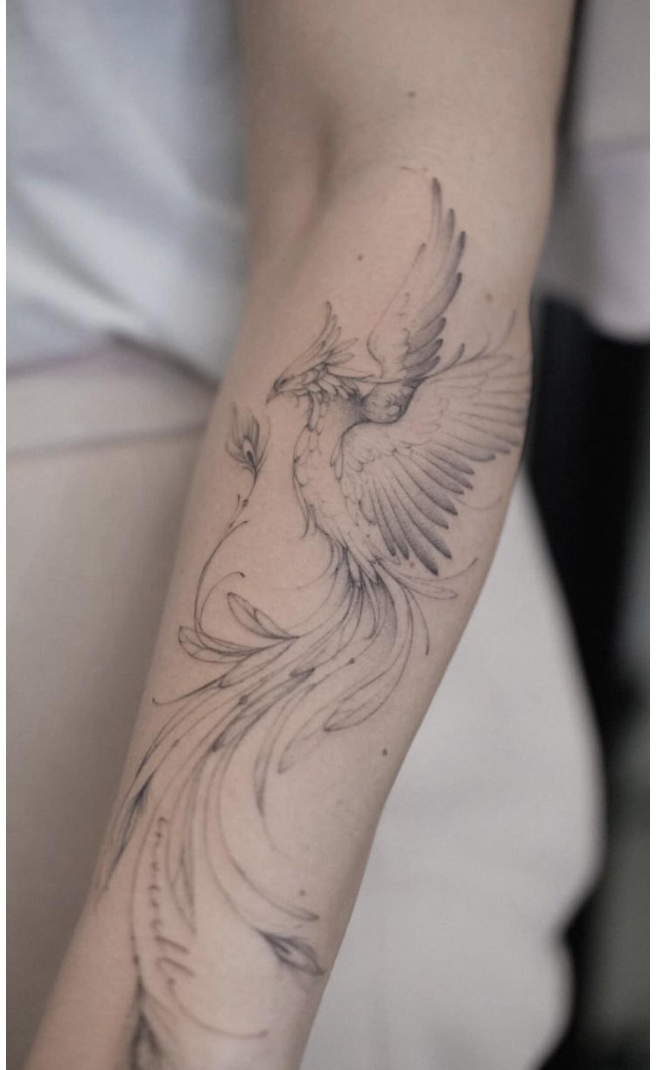Intricate Phoenix Arm Tattoo