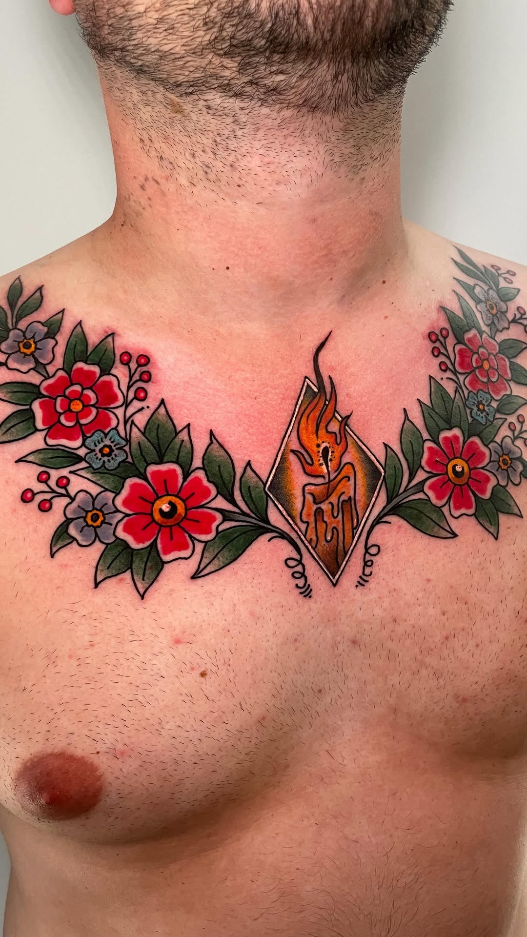 Neo-traditional floral and candle chest ink