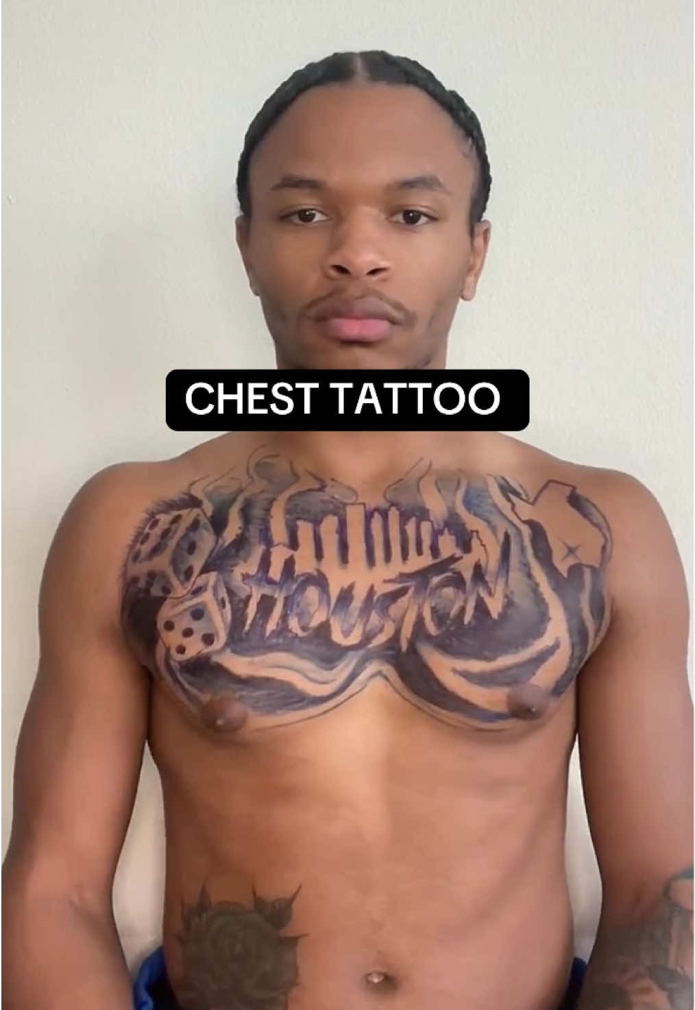 Bold typography chest tattoo
