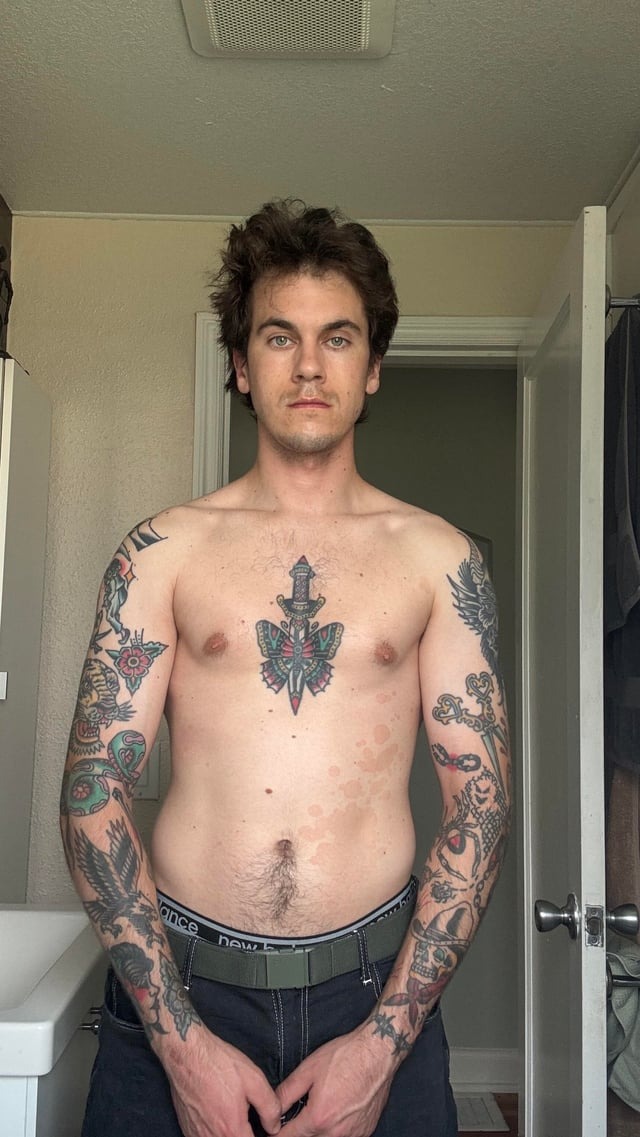 Dagger-themed center chest tattoo
