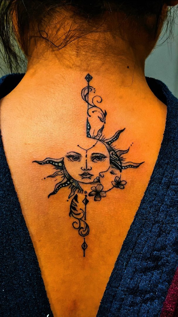 Intricate Sun and Moon Neck Tattoo