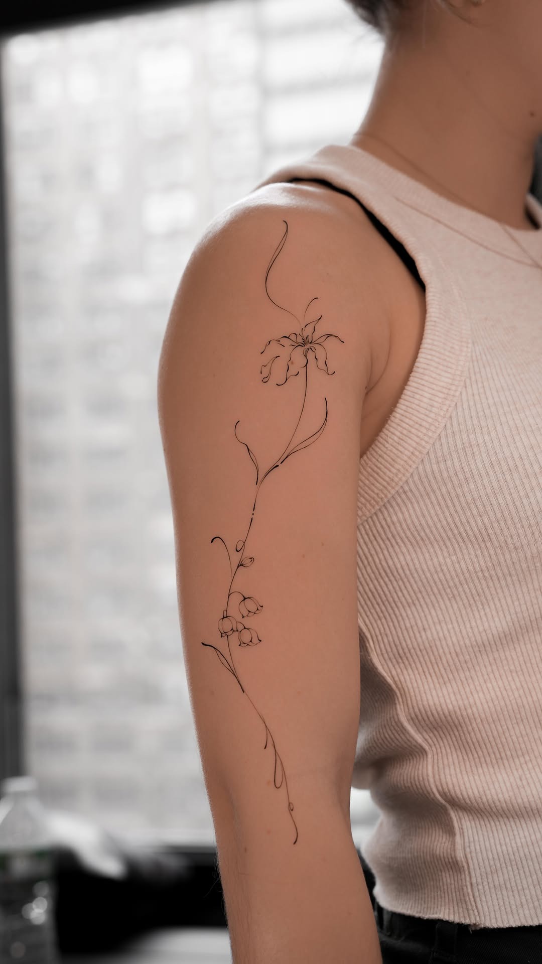 Delicate Fine-Line Lily of the Valley Arm Tattoo