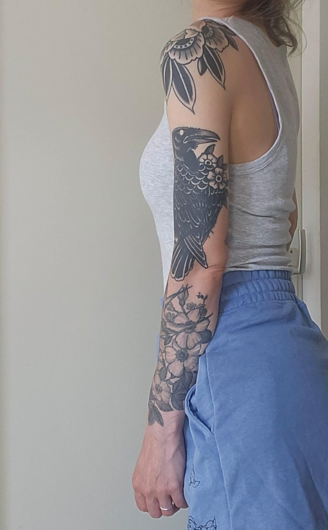 Elegant Blackwork Traditional Arm Tattoo