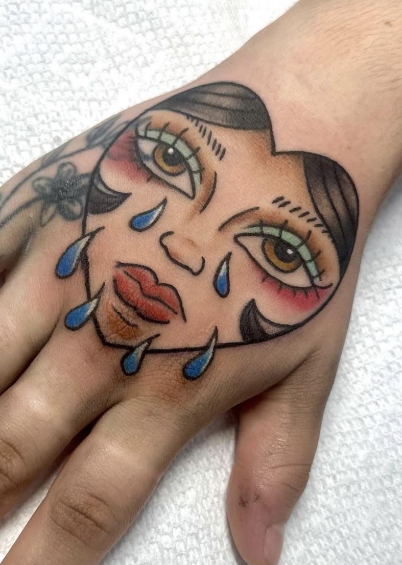 Unique Heart-Shaped Neo-Traditional Hand Tattoo
