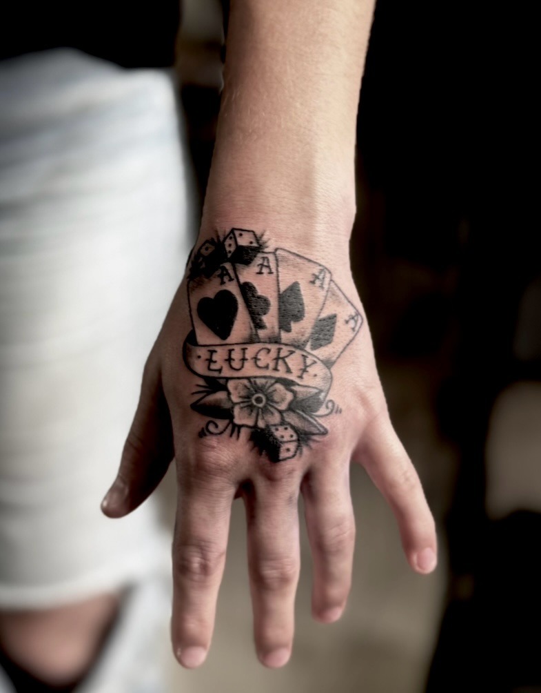 Lucky Hand Traditional Tattoo
