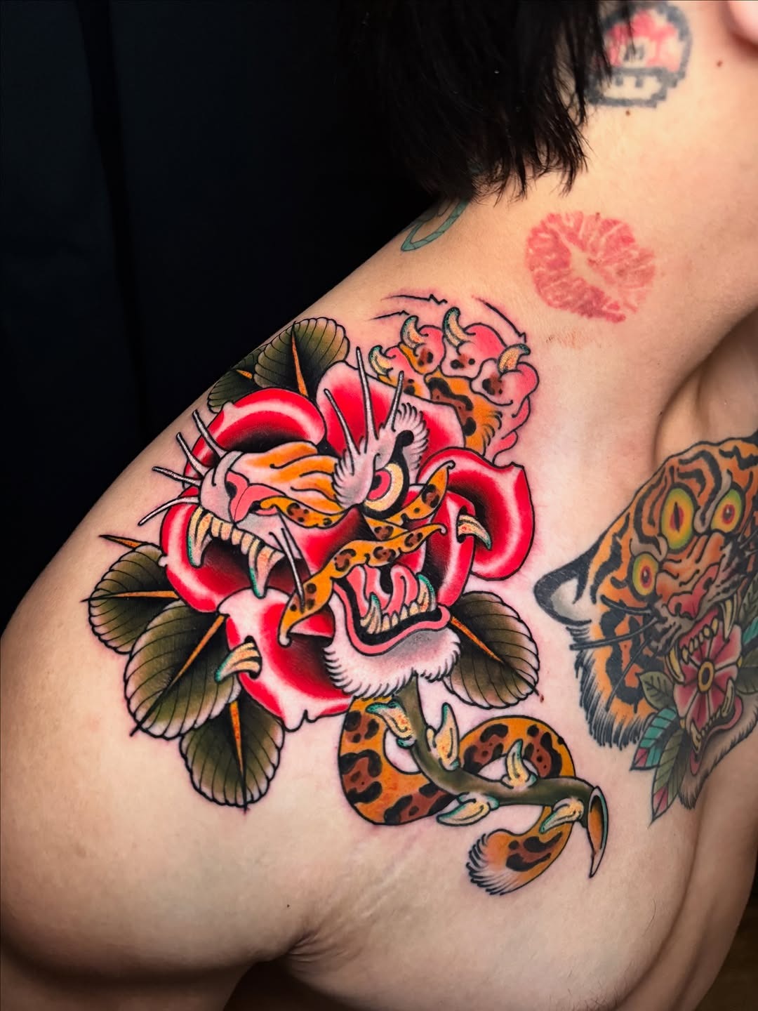 Intricate neo-traditional tiger rose tattoo