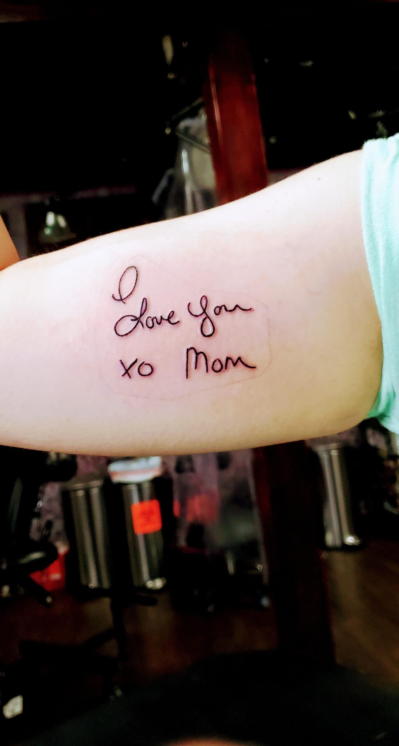 Heartfelt handwritten-style XO tattoo